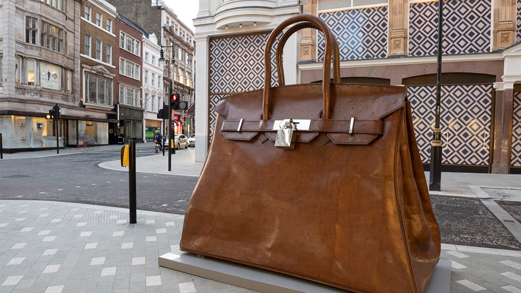 A huge Birkin bag and a giant plait 